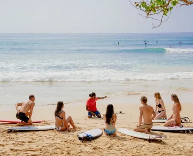 Surfer catching a wave at Siargao
